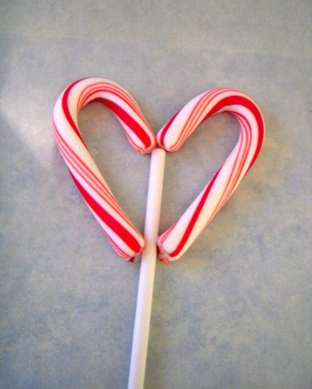 Place a stick through both halls if the candycane heart