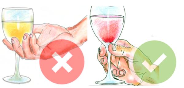 A glass of wine needs to be held by pinching the stem with your forefinger and thumb. Not by wrapping your hand around it.