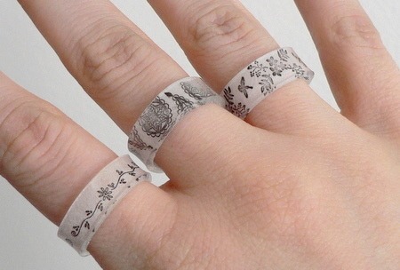 Shrinky-Dink Plastic Ring

Full instructions here:
http://www.curbly.com/m/6792-diy-shrinky-dink-plastic-ring
