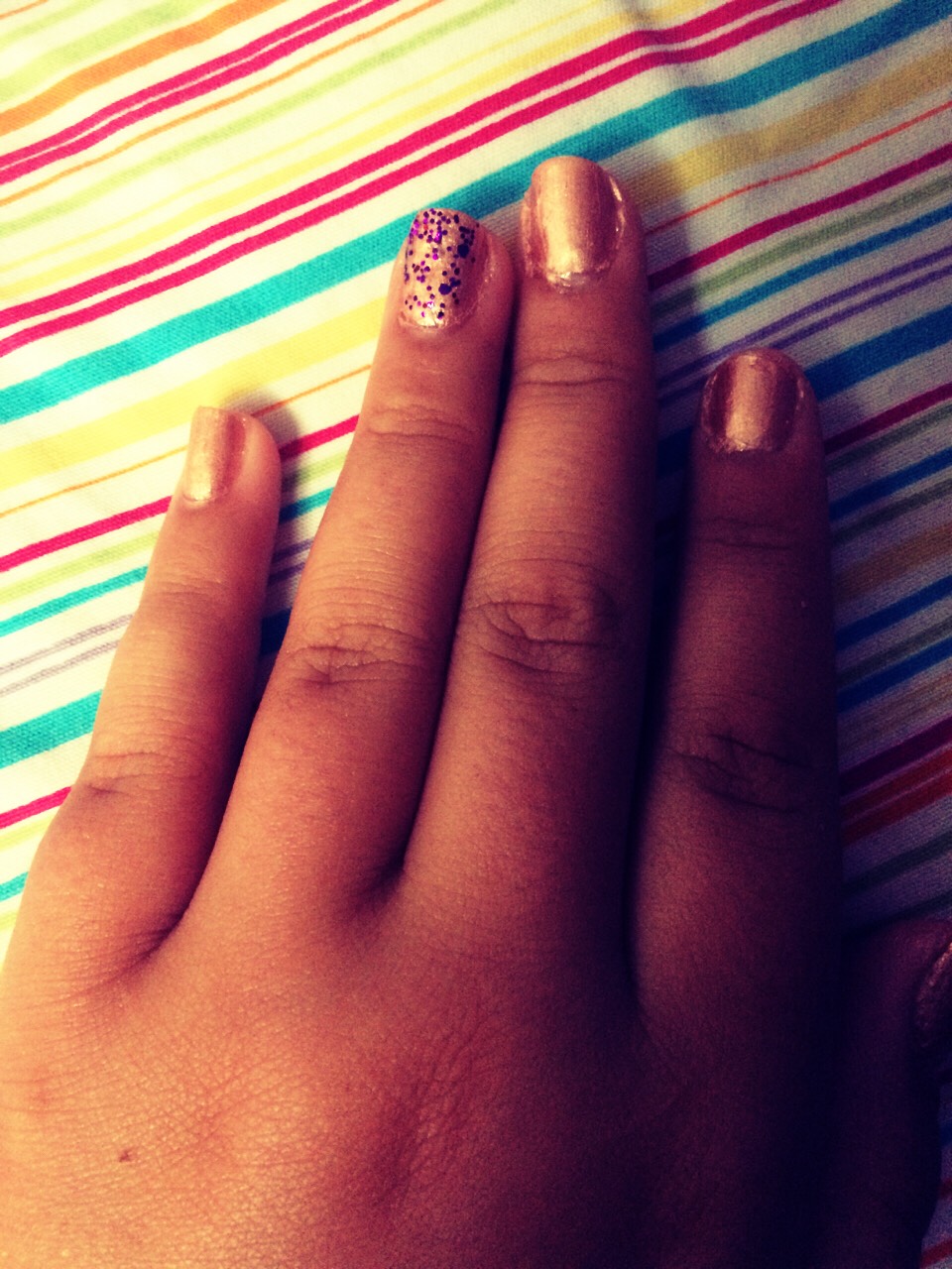 Apply glitter polish to the RING FINGER only
