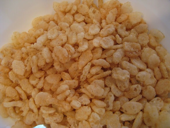 After they have both finished melting together, take the mixture off the heat and  stir in 2 cups of Rice Krispies. 
