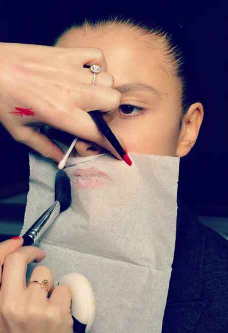 To make your lipstick last all day, hold a tissue over your lips and dust them with translucent powder.