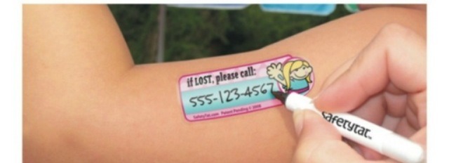 Use waterproof marker and write your cell number on a sticker. Then place it on your child's arm👍