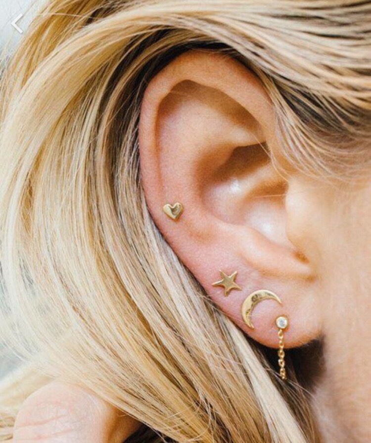Rubbing a little bit of Vaseline on your ears before putting earrings on makes it much easier to slide them through.