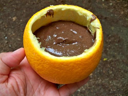 Fill each orange up a little past halfway with the cake mix.