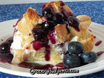 Blueberry Sauce:

2/3 cup white sugar
2 tablespoons cornstarch
1 cup water
1 1/2 cups fresh blueberries
1 tablespoon butter
1/2 tsp cinnamon, dash nutmeg

Lightly butter an 8.5"x11" inch baking dish, set aside. Cut the cream cheese into slices and then into pea sized bits.