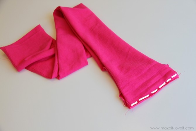 Next, grab your smaller strip of knit fabric (4 x 60) and sew the two ends together (with right sides together), using a 1/4 inch seam allowance.
