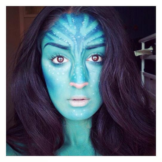 14. Make your face look screaming for Halloween, by applying blue paint and going for dots. Go for the pale pink lipstick and make the edge of your nose pink, as well.
