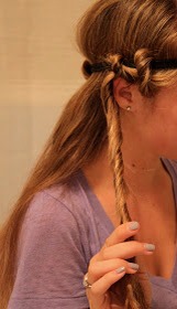Now start tucking the hair around the headband like this.