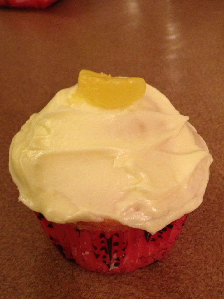 Frosting

1/2 cup unsalted butter
1 cup icing sugar (* may need to use more)
1/8 cup lemon juice
1/2 cup vodka 
Yellow food coloring 

1) combine butter, icing sugar & lemon juice
2) add vodka slowly until desired consistency 
3) add yellow color

Frost cupcakes top with lemon candy  
