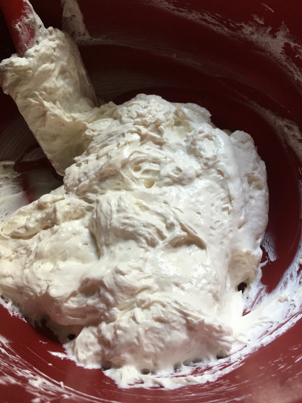 Mix the cream cheese, confectioners  sugar and vanilla extract with a hand mix. Incorporate whipped cream.