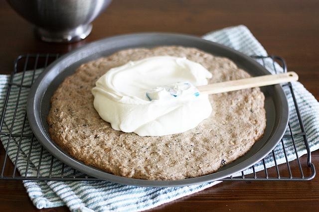 Bake until lightly brown on edges and set in the center, about 12 to 15 minutes. Cool completely on pizza pan, about 1 hour.
In a large bowl, beat whipping cream until soft peaks form. Stir in cream cheese frosting.