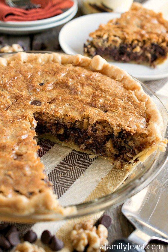 - 1 unbaked 9-inch deep-dish pie shell
- 2 eggs
- ½ cup all-purpose flour
- ½ cup granulated sugar
- ½ cup packed brown sugar
- ¾ cup (1½ sticks) butter, softened to room temperature
- 1 cup semi-sweet chocolate chips
- 1 cup chopped walnuts (optional)
Vanilla ice cream (for toppin')