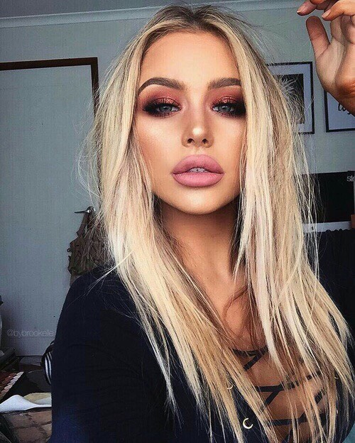 Apply eyeshadow and eyeliner.