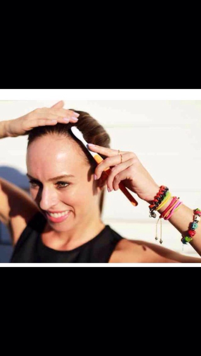 This method tames frizes!! Just get and old tooth brush, spray it with hairspray and sleek back hair to tame those frizezs 