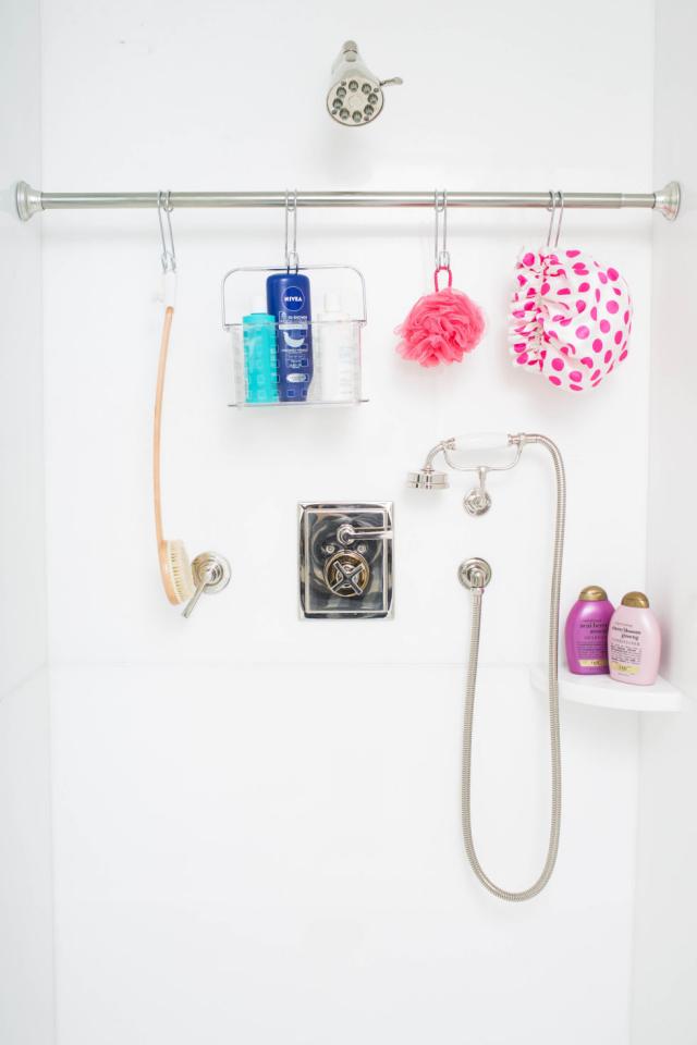 1. If your shower caddy is too small to hold all your products, install a second tension rod and use hooks to hang everything instead. This will create more room for storage and prevent mildew from gathering around the overflow of products piled in the corners of your shower.