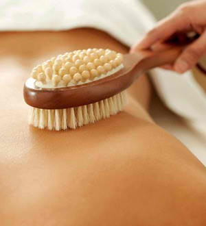 Start dry brushing
A dry brush is a great drugstore beauty buy. It costs about $10 and you can get it anywhere. Dry brushing is my favorite method of body exfoliation because it's multi-tasking—it's incredible as a cellulite treatment and increases elasticity.