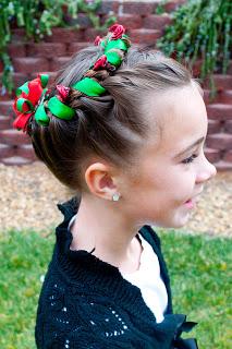 Tie your two ends of ribbon together to secure them and then cut off any excess. 

Now grab your Christmas hair clip and place it right over the ribbon ends.  We have used two here because we didn't have one that was quite big enough.  