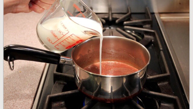 slowly pour the rest of the milk (3/4 cup) into the saucepan. Stir until it becomes hot and frothy.