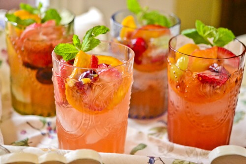 
Directions:
In a pitcher, combine peach schnapps, cognac, sugar, sliced oranges and sliced mangos. Chill for at least an hour. Add white wine and ginger ale to the mixture right before serving.