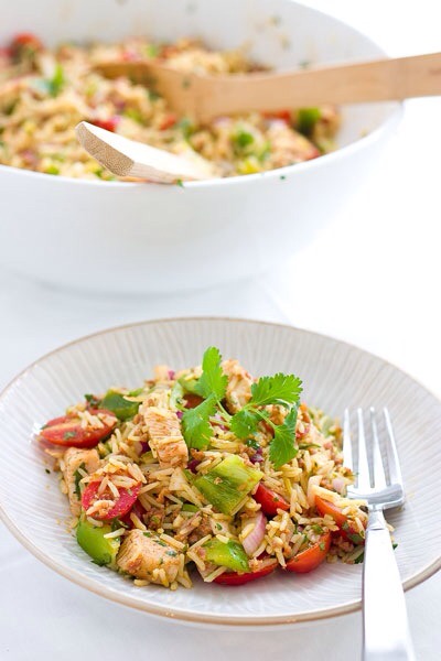 Paella Rice Salad

For a cool summer take on this typically warm dish, keep the veggies raw and just cook the rice! You can also mix it up by using shrimp instead of chicken, or take out the meat entirely for a vegetarian option.
