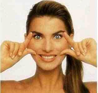 Face Exercise 14:

Place your index fingers on either side of your eyes and the thumbs on both sides of your mouth.
Pull the skin upwards with your fingers so as to feel a stretch on the muscles.
Relax and repeat again.
