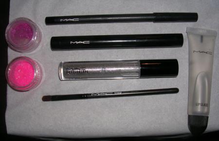 All MAC stuff: 316 lip brush, greasepaint stick, Feline kohl power liner, She-Zam dazzleglass, clear lipglass, Reflects Very Pink and Neon 60s glitters.