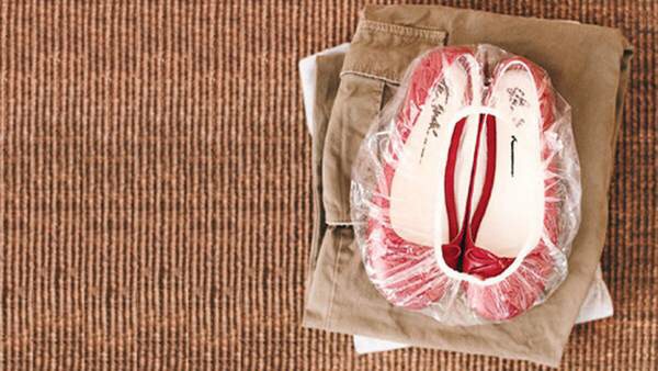When you pack a suitcase, wrap your shoes in a shower cap
