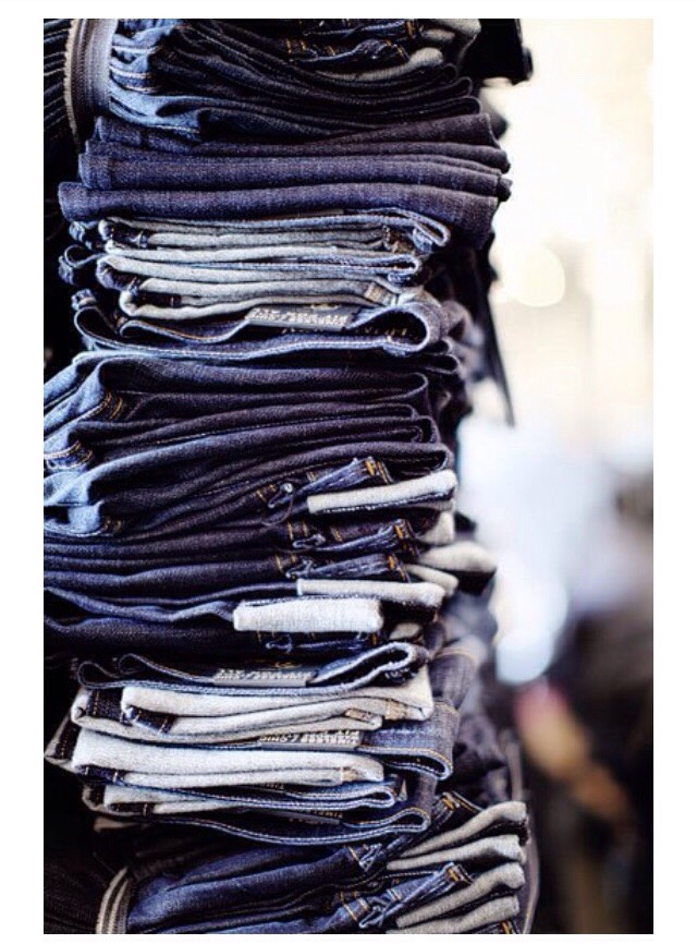 43. Fold jeans like a pro: Lay jeans on a flat surface, fold in half from left to right. Grab the stacked jean legs and fold them in half so the hem of the jeans lines up with the waistband. Fold the jeans in half one more time.