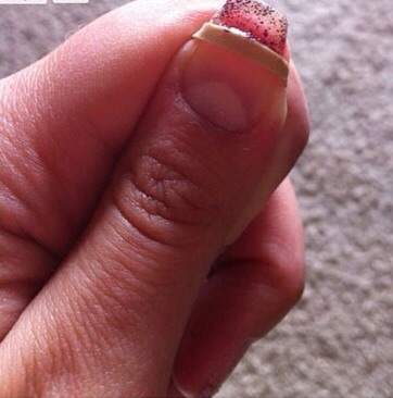 #8 use a rubber band as a guide for a French manicure 