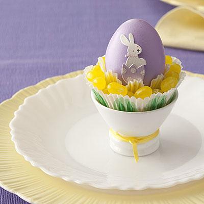 Spotlight an Egg

Use a scrapbook-embellishment bunny to decorate a dyed egg. Place a cupcake liner in an eggcup and fill with jelly beans. Nestle the egg into the candy. Your guests are sure to smile.