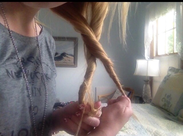 Cross the second piece of hair over the first, like an X, and begin twisting both twists around each other tightly. ❤️