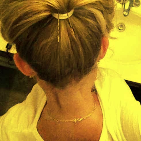 4. Make your ponytail POP by propping it up with two bobby pins.