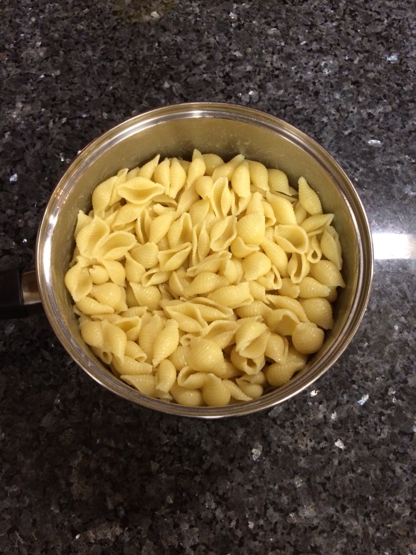 In a medium size pot boil water for pasta.
When water is at a boil, add pasta. Occasionally stirring, cook pasta 10-15 minutes. Drain & shock pasta with cold water. Add 4 tablespoons of butter to pot & add pasta to butter, occasionally stirring, to reheat for 5 minutes.