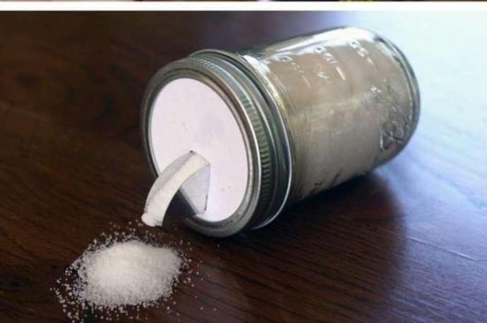 Make a cheap and cute container:
Use a mason jar and a salt lid for a quick DIY salt or sugar container. It's eco-friendly and cute!