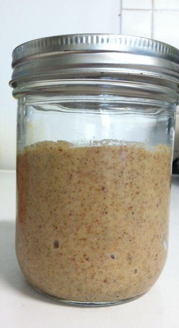 add the mush of raw almonds to container, then add coconut oil by the tablespoon until desired consistency. 