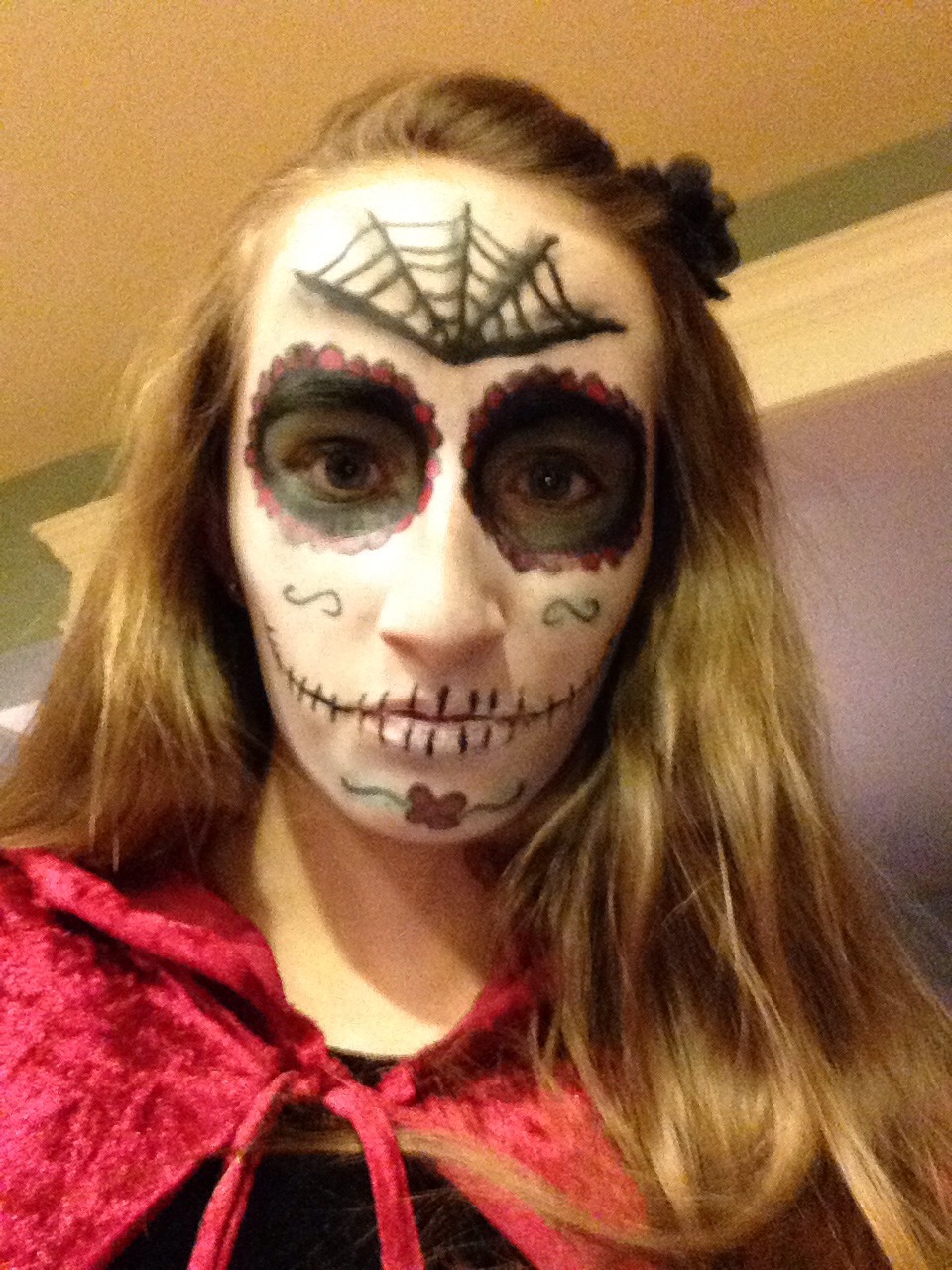 To make this web I drew one line down my forehead and added two more lines on each side. I connected the lines with curved lines and then added a shadow or contour to the web.  Viola! You have beautiful and creepy sugar skull makeup! 