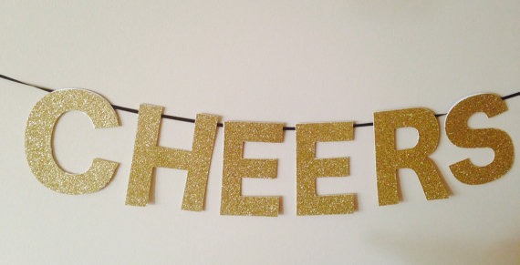 5. Gold Glitter Cheers Banner, perfect for New Years but can also be saved for other parties such as bachelorettes, Christmas, etc. From Seventh and J, $12.50.