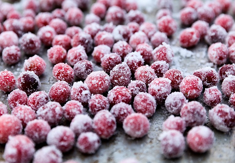 For the Sugar-Coated Cranberries: Pour the water and 1/2 cup of sugar into a saucepan over medium heat, stirring until the sugar has dissolved completely (hooray—you've created a simple syrup!). Let it cool for about 15-20 minutes, then add the cranberries, mixing so they're all thoroughly coated.
