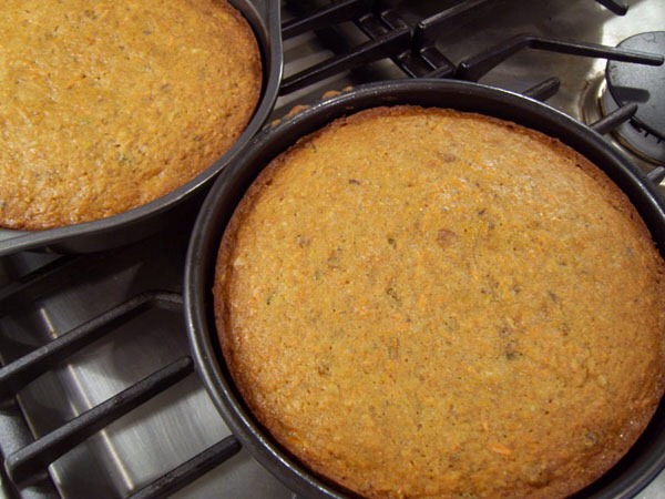 Bake the cake until the top springs back when gently pressed and a toothpick inserted into the centers comes out clean, about 1 hour to 1 hour and 10 minutes. Set the cake on the baking sheet on a wire rack to cool for 10 minutes. (The cake will pull away from the sides of the pan.)