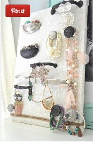 A blank canvas with knobs from dressers and drawers is perfect for holding all types if jewelry! Customize it to hold what you have most of 