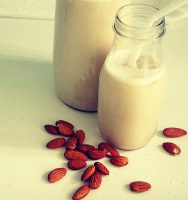 Instead of drinking regular milk, try drinking soy or almond milk instead. It is incredibly healthy for you and is way lower in fat and calories compared to regular milk. It will help you feel less bloated as well.