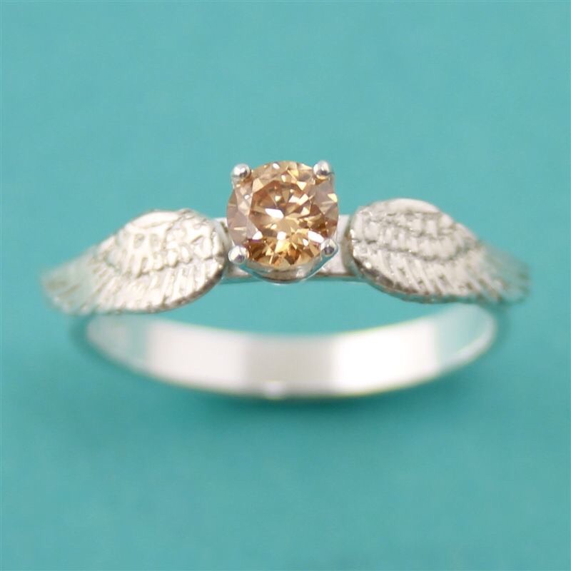 Harry Potter fan? This golden snitch engagement ring is for you!