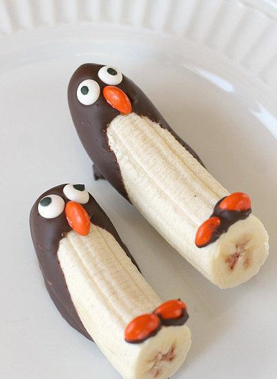 Fruity Penguins
For a healthier dessert, whip up these chocolate-covered penguins. Melt the chocolate, and let the kids decorate their edible friends