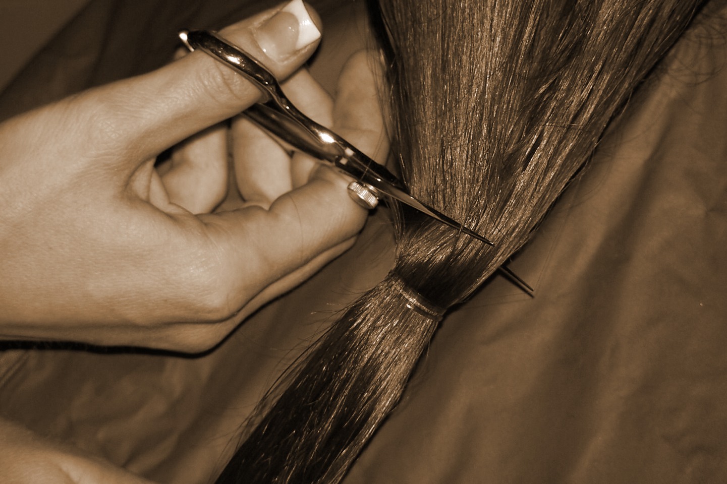 Do not get your hair cut !!!! It's a myth that cutting your hair makes it grow your hair grows from the roots just keep it in good condition and let it grow ! 
