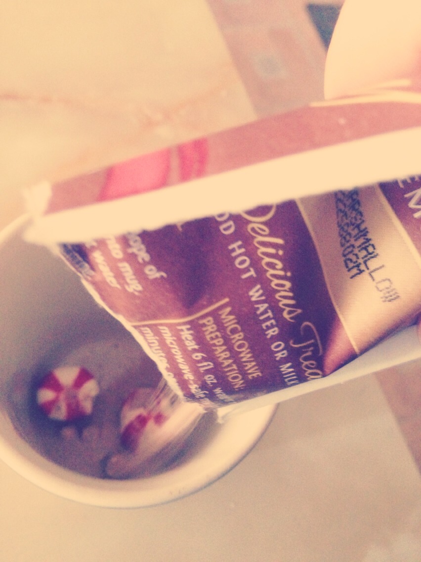 Then open hot chocolate mix and pour into mug.