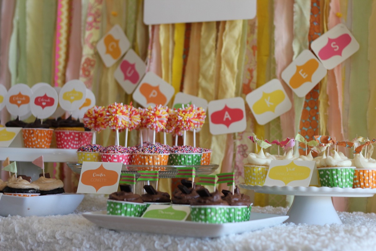4. Add dimension. Cake stands (and even boxes wrapped in paper) are the perfect way to add height and visual variety to your cupcake display. A white cake stand or two (or seven!) in your servingware collection are great versatile pieces, perfect for cupcake buffets and Nacho Bars alike.