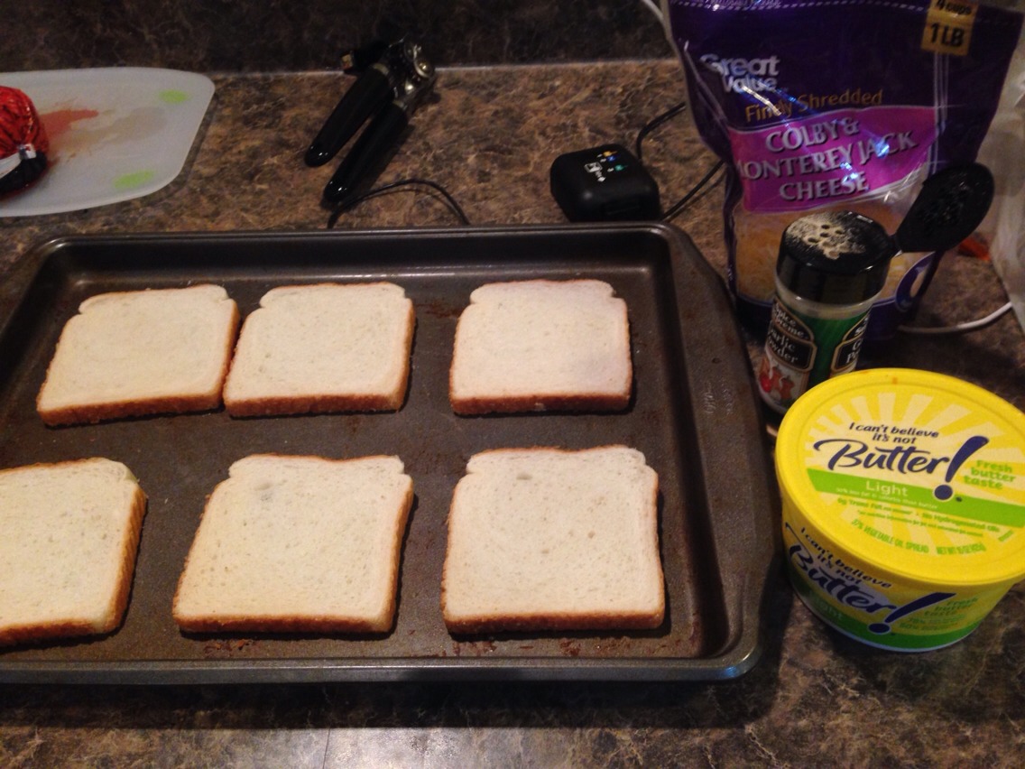 First lay the bread down on a pan 