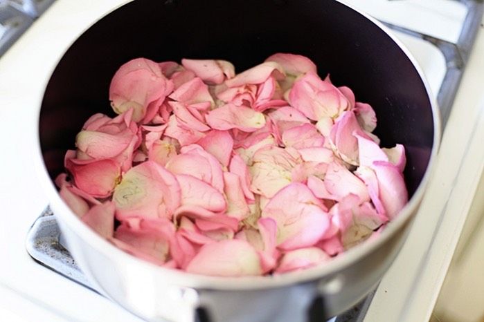 Pour the rosewater into each of the ice molds, then add in rose petals, and finish with water. Place molds in freezer and freeze until solid. When ready for your facial treatment, boil some water and pour into a large bowl. Place your face over the steaming bowl with a towel over your head for 1-2 minutes. 