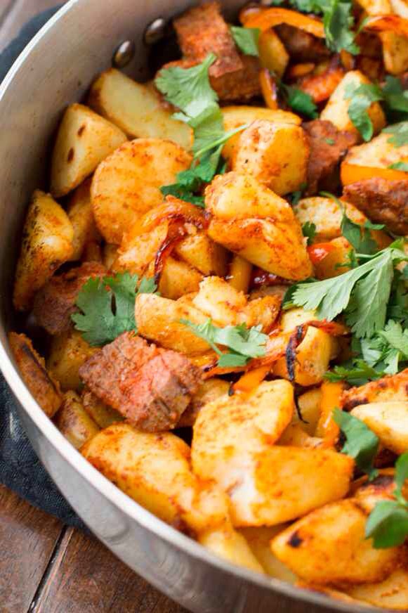 2. Steak & Potato Hash.
Steak + bell peppers + onion + spices + potatoes. (Note that with this and most other recipes on this list, you'll also need three pantry staples: salt, pepper, and olive oil.) Get the recipe.

ohsweetbasil.com